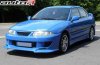 Mitsubishi Carisma (1995 - 1999)<br>MITSUBISHI CARISMA HB/SEDAN - przedni zderzak / front bumper - MC-F-01