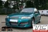 Mazda 323 (1997 - 2001)<br>MAZDA 323 P- przedni zderzak / front bumper- TC-323P-F-01