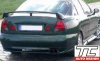 Mitsubishi Carisma (1995 - 2000)<br>MITSUBISHI CARISMA  - spoiler pod tylny zderzak / rear bumper spoiler ad on, skirts - TC-MC-02